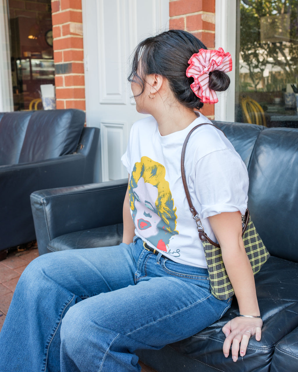 model wearing juniq brand scrunchie, pink-red stripes, overlocked trim, double layers